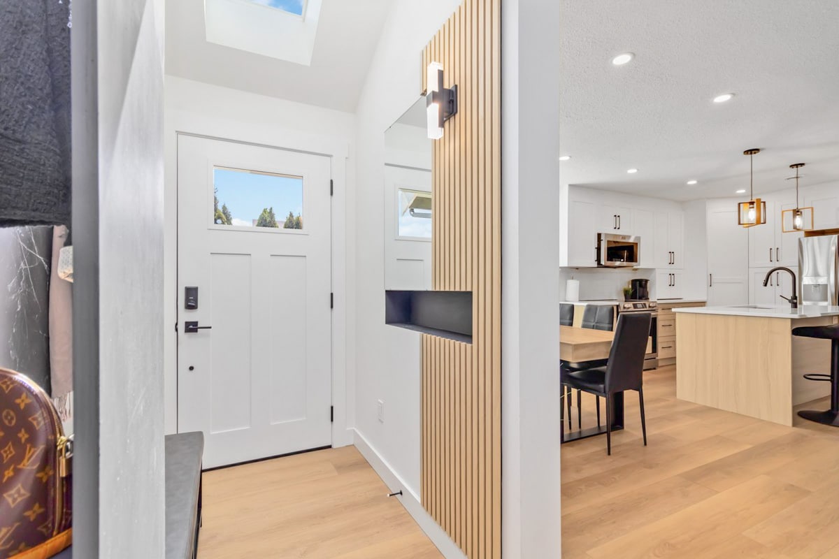 Modern entryway with open kitchen
